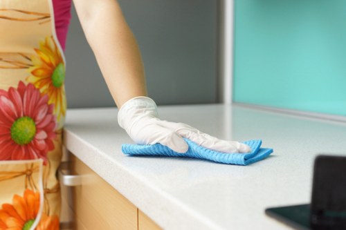 Team member using PPE during professional carpet cleaning in Soho